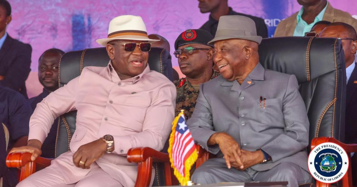 President Joseph Nyuma Boakai Sr. (right) shares a laugh with Julius Maada Bio (left) at the groundbreaking of the 255-km Western Corridor road project in Liberia. Photo: Executive Mansion