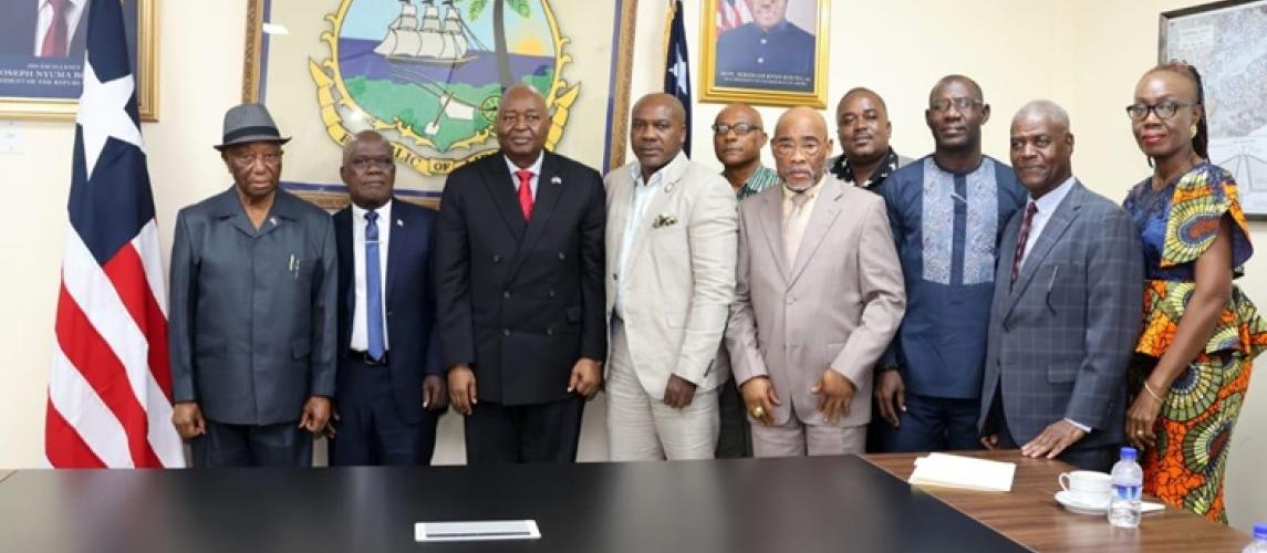 President Boakai posed in a photograph with members of the UL Board