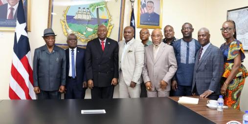 President Boakai posed in a photograph with members of the UL Board